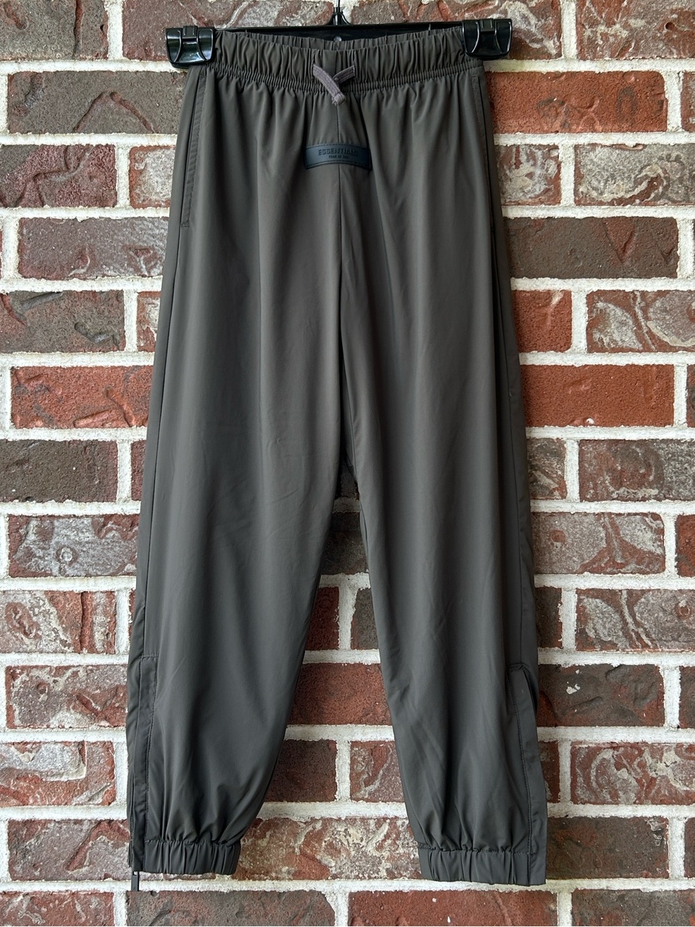 Essentials Fear of God Kids woven nylon track pant in Olive